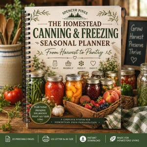 May include: A spiral-bound planner titled The Homestead Canning & Freezing Seasonal Planner From Harvest to Pantry. The cover features illustrations of mason jars filled with produce, a wooden crate, and text detailing a food preservation system.