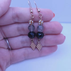 Black and Gray Beaded Dangle Earrings with Gold-Plated Charms and Rhinestone Accents