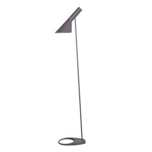 May include: A tall, dark gray floor lamp featuring a slender, vertical metal stem that connects to a wide, flat, oval-shaped base. The lamp head is an angled, conical shade that directs light downward, attached to the top of the thin support pole.