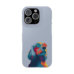 May include: A light blue phone case featuring a colorful pop art style illustration of a dog wearing sunglasses. The dog's fur is a mix of blue, orange, and yellow. The sunglasses have blue and red lenses.