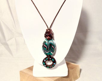 Purple, green, pink and turquoise artisan made glass bead necklace on leather cord