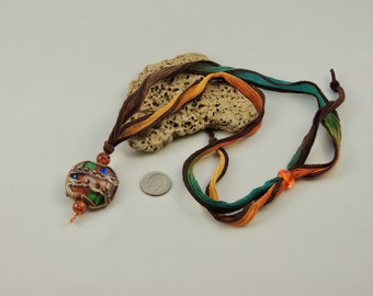 Artisan made glass bead pendant with silk cord