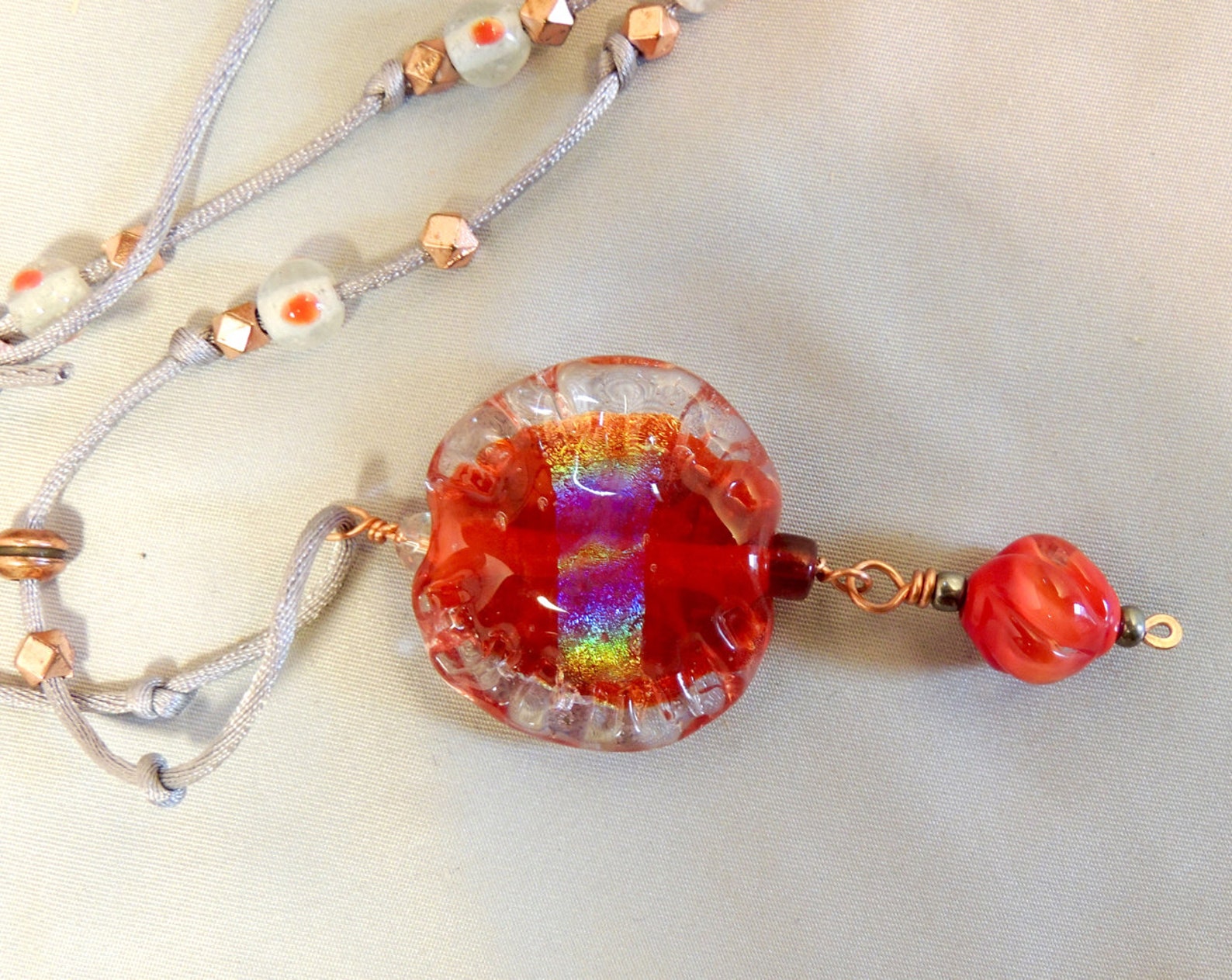 Artisan Made Glass Bead Pendant With Shimmering Red Focal Bead on Gray