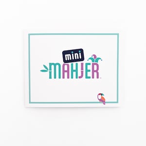May include: A white card with a teal border and a logo that says "mini mahjer" in pink and teal lettering. The logo also includes a small blue square with the word "mini" in white lettering and a jester's hat in teal and white. A small pink and teal toucan is in the bottom right corner of the card.