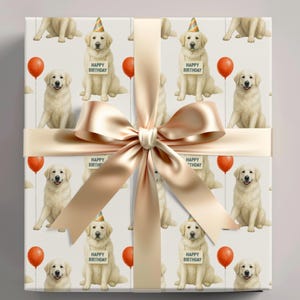 Birthday gift wrap featuring a repeating watercolor pattern of Great Pyrenees. The dogs wear party hats and appear with balloons on a neutral cream background. Shown wrapped around a gift box tied with a cream satin ribbon.