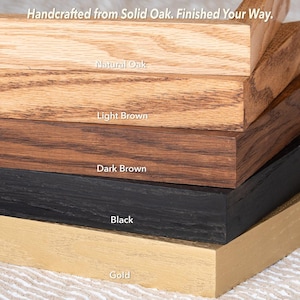 May include: Close-up of solid oak wood samples in various finishes. The finishes include natural oak, light brown, dark brown, black, and gold. The text "Handcrafted from Solid Oak. Finished Your Way." is at the top.