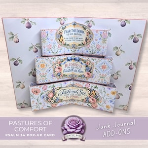 May include: A three-tiered pop-up card featuring a light blue background with a repeating fig pattern. Each tier displays floral borders and religious text: FEAR THE LORD, YE HIS SAINTS, BLESSED IS THE MAN THAT TRUSTETH IN HIM, and TASTE AND SEE.