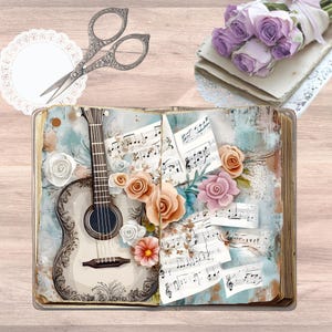 Peut inclure: Un livre ouvert illustré d'une guitare, de partitions musicales et de fleurs en papier dans des tons pêche, rose et blanc. Au-dessus du livre se trouvent des ciseaux argentés ornés, un napperon en dentelle blanche et un bouquet de roses lavande.