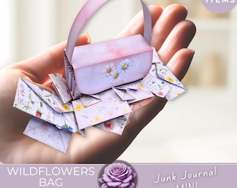 May include: A miniature paper bag and accordion folio with a floral design. The bag is light purple with daisy accents, and the folio is filled with small, floral-patterned envelopes. The image includes the text "Wildflowers Bag" and "Junk Journal Mini".