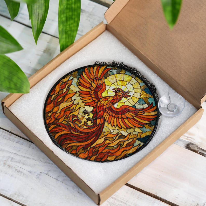 a stained glass picture of a bird in a box