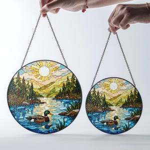 a pair of stained glass hanging from chains
