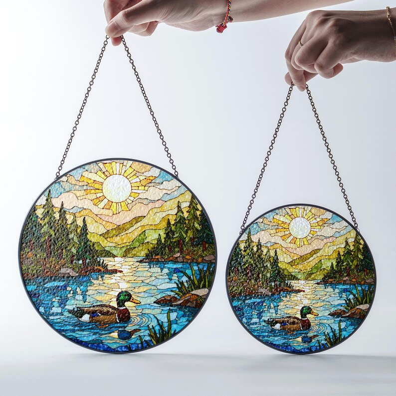 a pair of stained glass hanging from chains