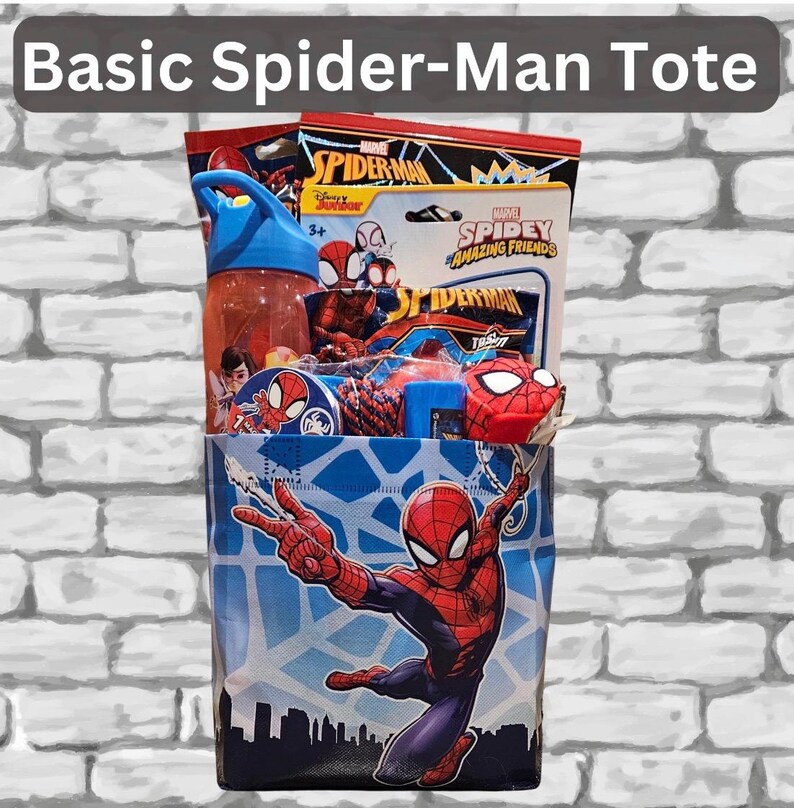 May include: A blue tote bag featuring Spider-Man with a cityscape design. The tote is filled with Spider-Man themed items, including a water bottle, toys, and packaged treats. The text "Basic Spider-Man Tote" is at the top.