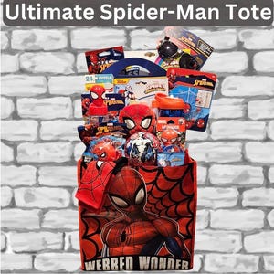 May include: A red tote bag filled with Spider-Man themed merchandise. The bag features a large Spider-Man graphic and the text "WERRED WONDER". Contents include a puzzle, plush toys, sunglasses, and a water bottle.
