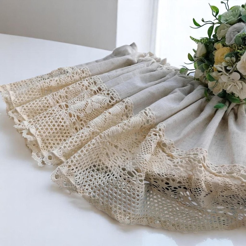 Victorian white cotton cafe curtain with ruffled valance and shabby chic lace trim, hung on a rustic window for French Country kitchens
