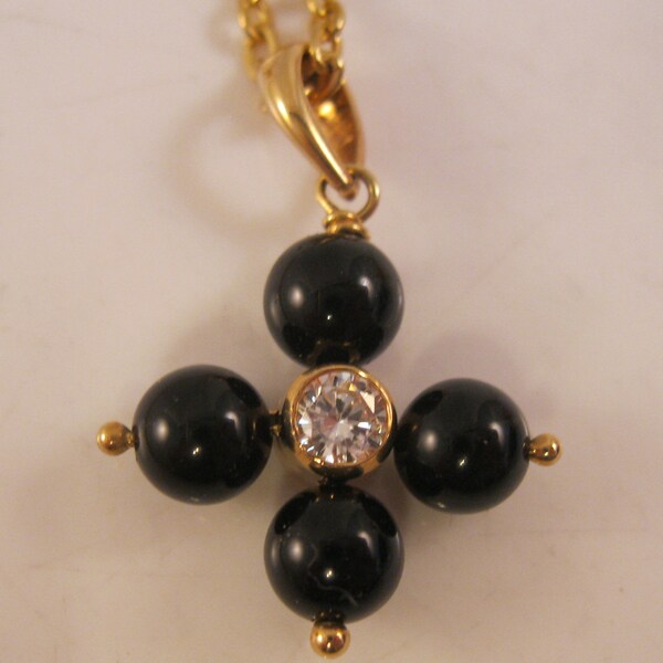 Extends Onyx Signature Cross Bracelet