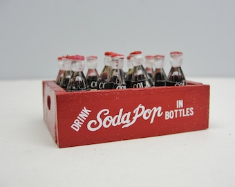 Mini soda crate and bottles of soda