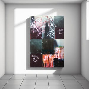 May include: Abstract art piece composed of nine square panels. Each panel features a unique blend of colors and textures, with graffiti-style markings in white and pink. The artwork is mounted on a white wall in a well-lit room.