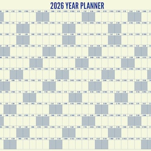 May include: A 2026 year planner with a cream-colored background and blue grid lines. The title "2026 YEAR PLANNER" is at the top, with the phrase "THIS IS YOUR YEAR" on the right. The planner is designed to track the entire year.