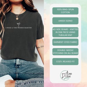 May include: Graphite-coloured t-shirt with the text "I NEED A TINI WEENIE MARTINI" and a martini glass graphic. Features include 100% ring-spun cotton, unisex sizing, no side seams, garment-dyed fabric, double-needle stitching, and a cosy, relaxed fit.