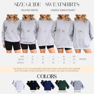 May include: Size guide for Gildan 18000 unisex sweatshirts. The image shows a size chart with measurements in inches for sizes S to 2XL. The available colours are white, black, navy, forest green, and sport grey.
