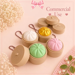 May include: A collection of miniature steamed bun charms in bamboo-style containers, featuring white, gold, pink, and green buns. Each charm includes a small ball chain. The text Commercial Use is printed in the upper right corner with a pink bow.
