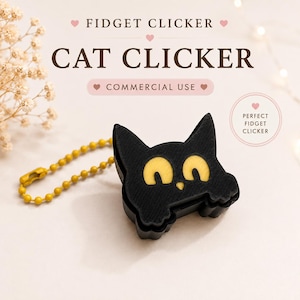 May include: A black cat-shaped fidget clicker with yellow eyes and a small nose, attached to a yellow ball chain. The text reads FIDGET CLICKER, CAT CLICKER, COMMERCIAL USE, and PERFECT FIDGET CLICKER. The object has a textured, layered surface.