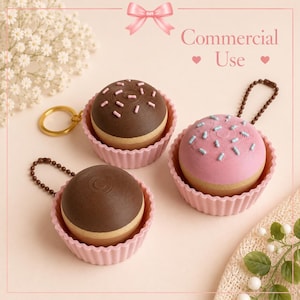May include: Three cupcake-shaped keychains in pink silicone liners. One has a brown top with pink sprinkles and a gold ring, one has a pink top with blue sprinkles and a brown chain, and one has a brown top and a brown chain. Text reads Commercial Use.