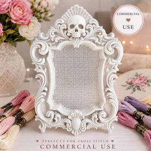 May include: A white ornate frame featuring a skull at the top and a perforated grid center. The frame has intricate scrollwork and flourishes throughout its structure. The text COMMERCIAL USE is visible in a circular badge in the upper right corner.