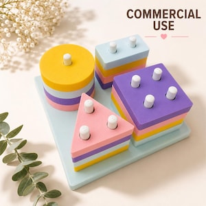 May include: A wooden shape sorting toy featuring a light blue rectangular base with four pegs. The set includes a yellow circle, a light blue rectangle, a purple square, and a pink triangle, all stacked on white pegs. Text reads COMMERCIAL USE.