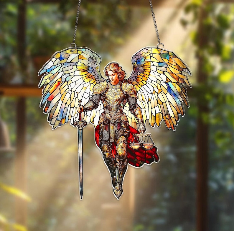 May include: Stained glass angel with outstretched wings, holding a sword and scales. The angel is clad in golden armor and a red cape. The wings are a mosaic of colorful glass pieces, suspended by a chain.