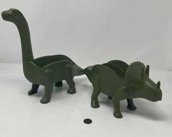 Dinosaur Taco Holders. Plastic Dinosaur Taco Holders. Delicious Hard Shell Tacos Holder. Taco Tuesday Excitement.