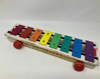 Vintage Fisher Price Pull a Tune Xylophone. No pull string but still sounds great when rolled. Boredom Buster for Your Chickens.