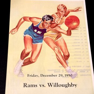 May include: Vintage basketball-themed print featuring two players in action. One player wears a blue jersey with the number 15, the other a yellow jersey. The image includes the text "Friday, December 29, 1950" and "Rams vs. Willoughby."