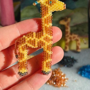 May include: A light blue blazer with a white and light blue patterned design. The blazer has a classic lapel and two front pockets. The fabric appears to be a lightweight material, suitable for warmer weather.