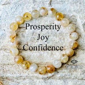 Close-up of the Citrine bracelet with the words "Prosperity, Joy, Confidence" overlaid, showcasing the bead's natural beauty.