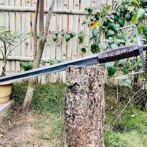 May include: A set of three ceramic nesting bowls in shades of blue, green, and white. The bowls feature a speckled glaze and a simple, modern design. The largest bowl measures approximately 8 inches in diameter.