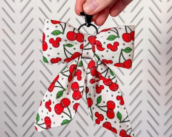 de sac cerise Mickeys noeud | Bijou de sac baume à lèvres