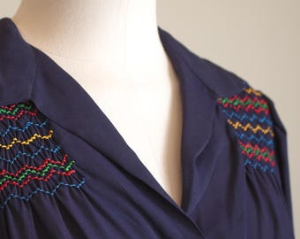 Vintage 1940s navy rayon crepe maternity blouse: smocked yoke with rainbow stitching, long sleeves, size M