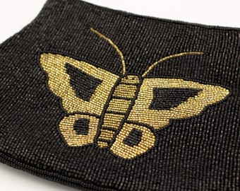 Vintage 1970s butterfly beaded clutch purse with black and gold seed beads