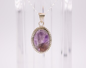 Vintage 925 sterling silver oval pendant, amethyst with citrine inclusions cabochon and braided border