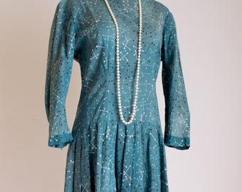 Vintage 1940s atomic print cotton midi day dress with drop waist, pleated skirt, 3/4 sleeves, modest neckline, size M