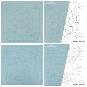 Peut inclure: Carrés de tissu bleu clair avec des motifs brodés. L'un présente un motif floral géométrique, l'autre représente le Mont Fuji avec des fleurs de cerisier et des nuages. Les motifs sont cousus avec un fil bleu clair.