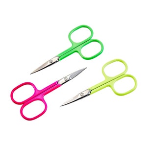 May include: Three pairs of small scissors with colourful plastic handles. One pair is green, one is yellow, and one is pink.