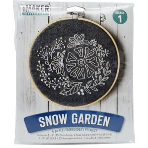 May include: Snow Garden felt embroidery project kit with a 15.2 cm hoop, black felt, white embroidery floss, and instructions. Makes 1 project.