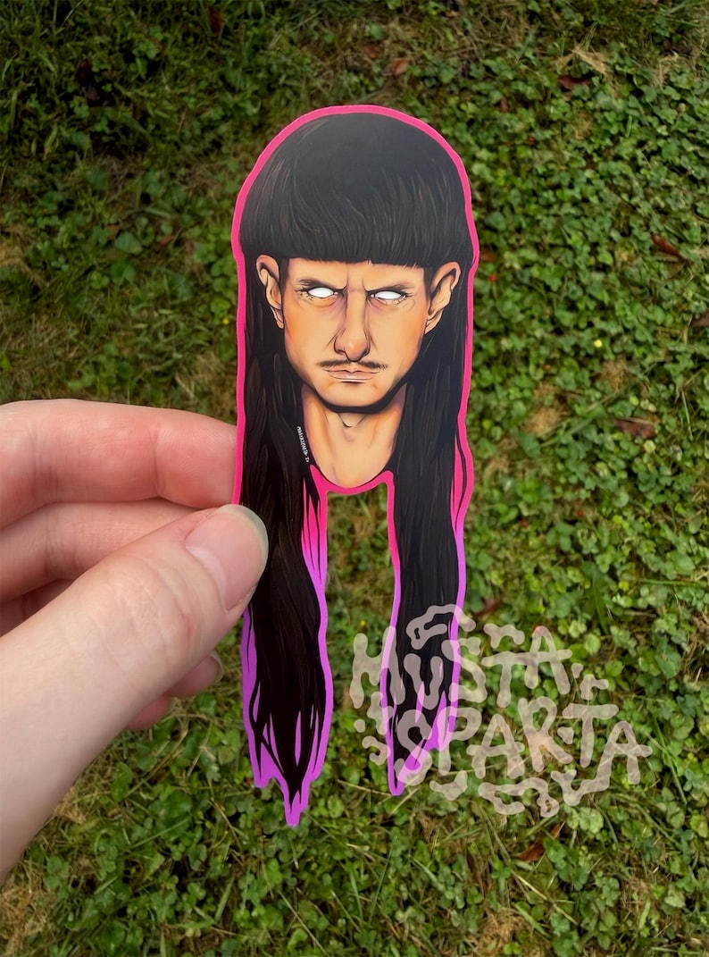 May include: A die-cut sticker featuring a stylised illustration of a person with a dark brown mullet hairstyle, a thin moustache, and glowing white eyes. The sticker has a vibrant neon pink border and includes the text MUSTA SPARTA in white.