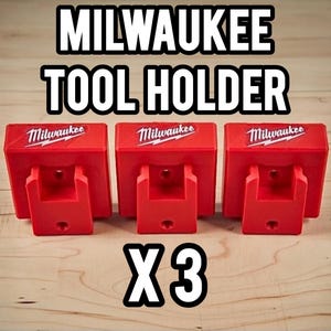 May include: Three red Milwaukee tool holders are shown. Each holder features the Milwaukee logo in white. The text "MILWAUKEE TOOL HOLDER" is at the top, and "X3" is at the bottom of the image.