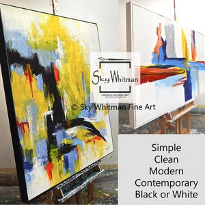 May include: Two abstract paintings on canvases with black frames. The painting on the left is a vertical composition with bold strokes of yellow, blue, red, and black. The painting on the right is a horizontal composition with a white background and bold strokes of red, blue, yellow, and gray. The text "Sky Whitman Fine Art" is visible in the bottom right corner of the image.
