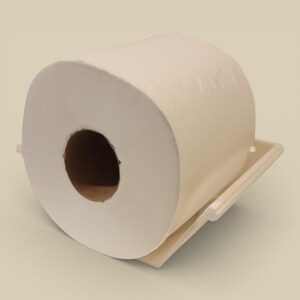 May include: A large roll of off-white toilet paper is positioned on a matching holder. The paper is tightly wound, with a visible cardboard core. The holder is a simple, rectangular design, providing support for the roll.