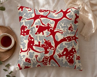 Red and blue statement decorative cushion – abstract organic pattern on cream